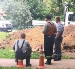 Worker sitting on traffic cone Meme Template