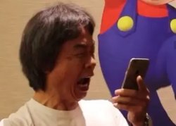 Shiguru Miyamoto looking at his phone Meme Template