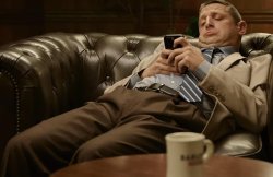 On phone on couch Meme Template