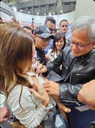 Jensen Huang signing a bra Meme Template