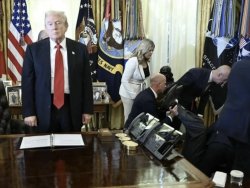 Trump stares as man passes out Meme Template