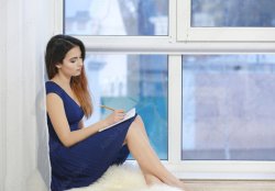 Woman writes at window Meme Template