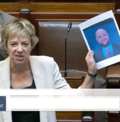 Politician holding up picture of JD Vance Meme Template