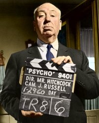 Hitchcock holding Psycho sign Meme Template