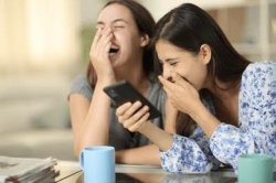 Girls laughing at phone Meme Template