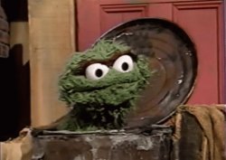 Oscar the Grouch in trashcan laughing Meme Template