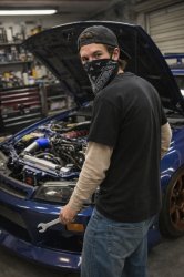 Beige-Sleeved Alexander Tuning A Car Meme Template