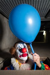 Clown holds a blue balloon Meme Template