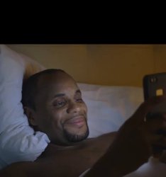 man looking at phone smiling Meme Template