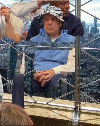 Roy in the hat on top of the Empire State building Meme Template