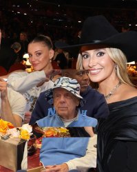 Roy in the hat sitting next to Lainey Wilson at the 2026 Grammys Meme Template