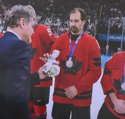 canadian hockey player receives stuffed animal mascot Meme Template