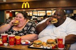 Fat black and white people eating McDonald's Meme Template