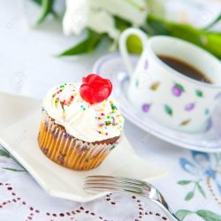 14772455-Pretty-cupcake-with-a-cup-of-coffee-Stock-Photo Meme Template