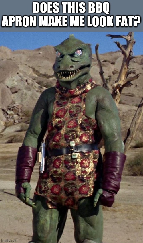 Gorn in BBQ Apron | DOES THIS BBQ APRON MAKE ME LOOK FAT? | image tagged in gorn | made w/ Imgflip meme maker