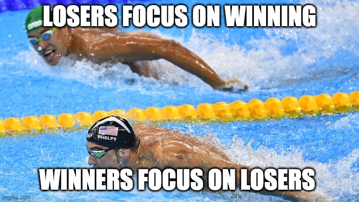 Michael Phelps | LOSERS FOCUS ON WINNING; WINNERS FOCUS ON LOSERS | image tagged in michael phelps | made w/ Imgflip meme maker