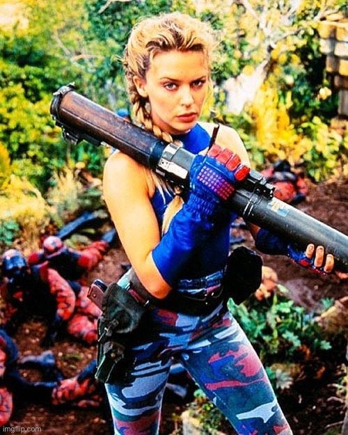 Gripping a bazooka in “Street Fighter” | image tagged in kylie bazooka,street fighter,actress,movie,military,yikes | made w/ Imgflip meme maker