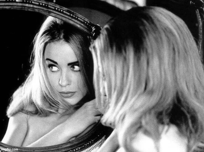 Gazing into the mirror, reversed. | image tagged in kylie mirror reverse,mirror,black and white,cute girl,reaction,reactions | made w/ Imgflip meme maker