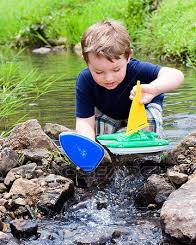 High Quality Kid playing with boat Blank Meme Template