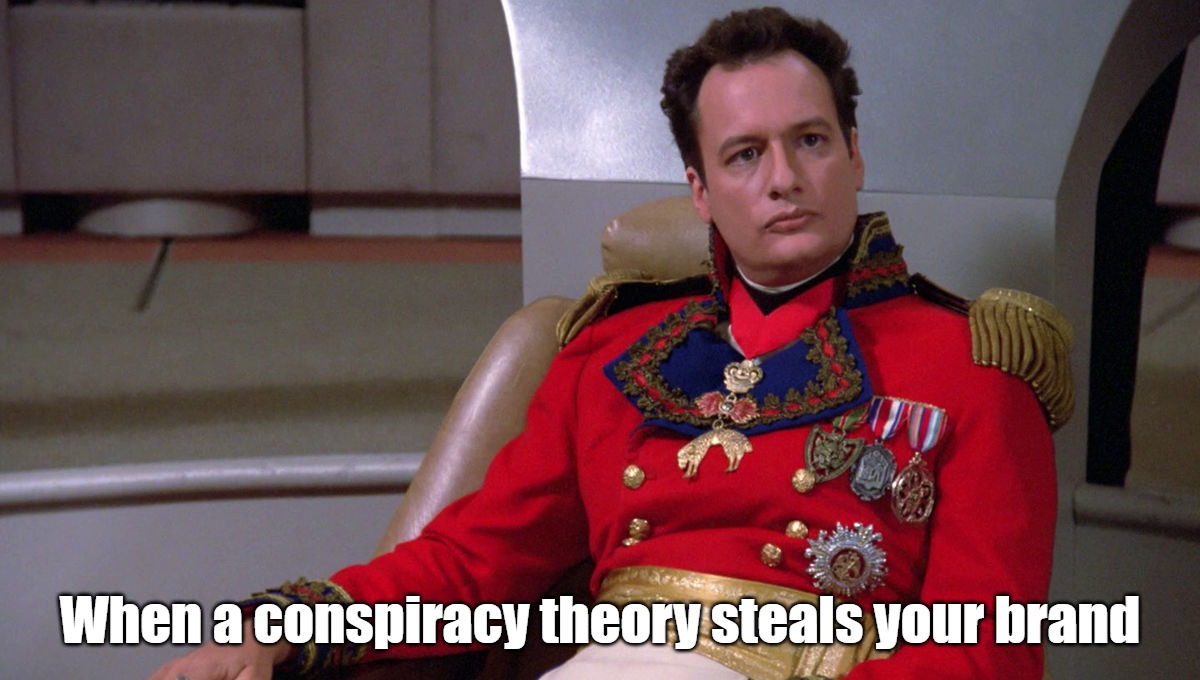 When a conspiracy theory steals your brand | When a conspiracy theory steals your brand | image tagged in q is very annoyed,politics,star trek,star trek the next generation,q,qanon | made w/ Imgflip meme maker