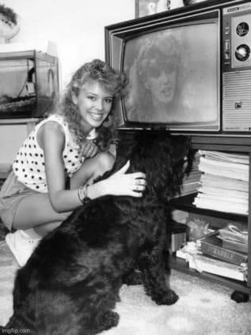 Kylie & her dog Gabby watching Kylie on “Neighbours,” 1987. | image tagged in kylie tv,1980s,1980's,television,dog,black and white | made w/ Imgflip meme maker