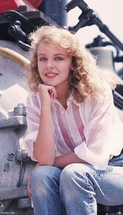 Young Kylie with blonde hair. Looks like on the set of "Neighbours." | image tagged in kylie young,curly,hair,1980s,1980's,cute girl | made w/ Imgflip meme maker