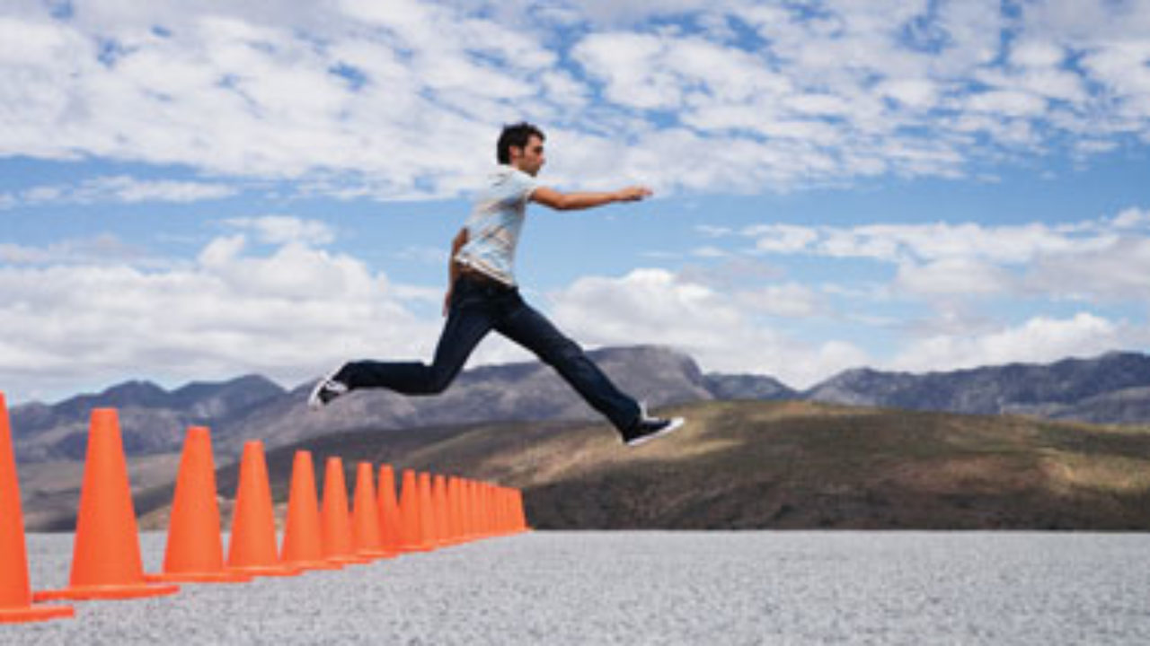 High Quality Man Leaps Over Row Of Obstacle Pilons In Desert Playa Blank Meme Template