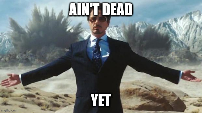 Iron Man | AIN'T DEAD YET | image tagged in iron man | made w/ Imgflip meme maker
