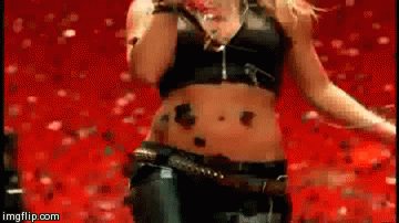 Britney spears struts forward belly button ring first.