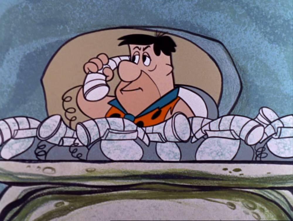 Fred Flintstone on the phone. 