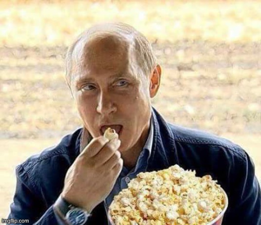 Putin eats popcorn while Trump makes America small and weak. | image tagged in putin eats popcorn while trump makes america small and weak,putin,eating,popcorn,trump,america | made w/ Imgflip meme maker