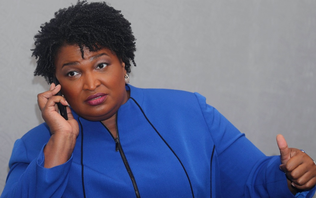 stacey abrams on phone Blank Meme Template