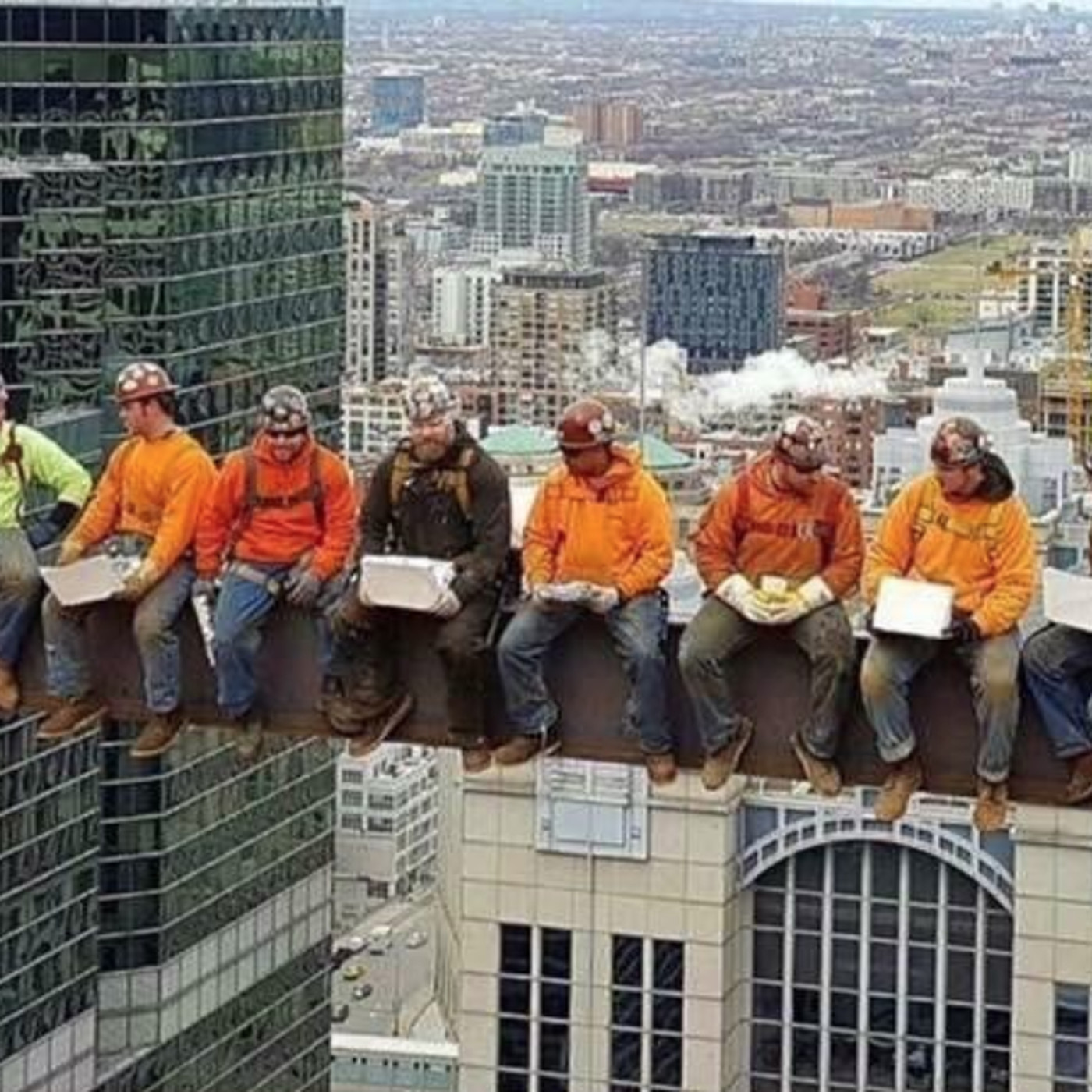 workers eating lunch on beam