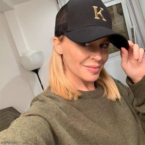 K. sending a socially-distanced social media shoutout to all the flat dwellers of the world | image tagged in kylie cap,social distancing,social distance,selfie,quarantine,hat | made w/ Imgflip meme maker