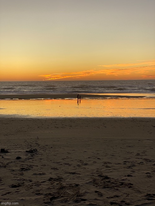 Sunset at the beach. Yes the two people in the background are me and my sister | image tagged in beach,sunset,sisters | made w/ Imgflip meme maker