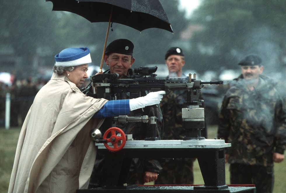 High Quality Queen Elizabeth Shooting A Machine Gun Blank Meme Template