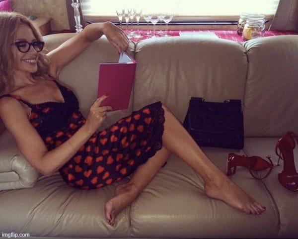 Kylie Minogue | image tagged in kylie book,book,reading,high heels,legs,couch | made w/ Imgflip meme maker