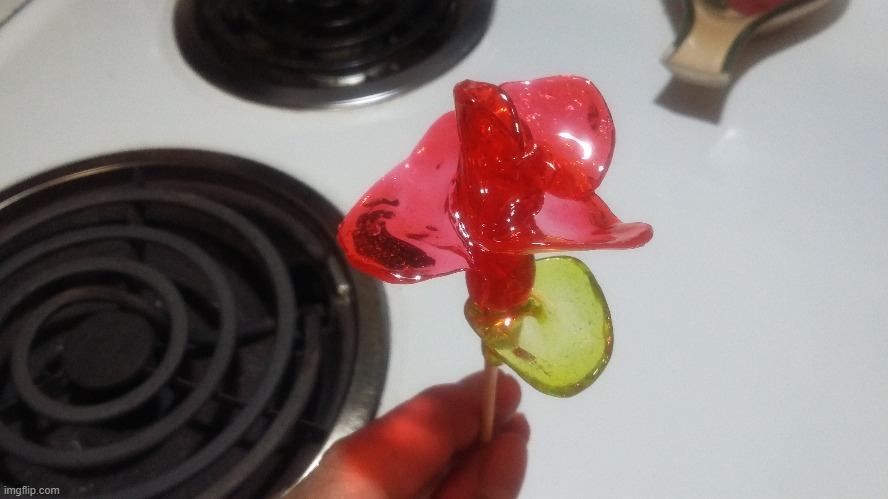 Check out this Jolly Rancher Flower I made out of 4 Cherry and 1 Green Apple Jolly Ranchers | image tagged in jolly rancher flowers,memes,food,art,candy,food art | made w/ Imgflip meme maker