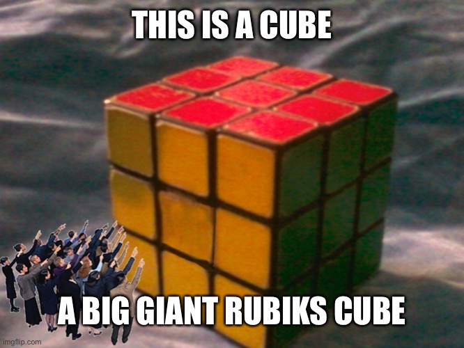 Aint it cute | THIS IS A CUBE; A BIG GIANT RUBIKS CUBE | image tagged in giant rubiks cube | made w/ Imgflip meme maker