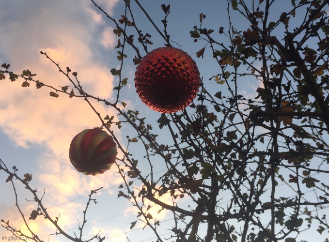 It’s beginning to look a lot like Christmas | image tagged in ornaments,tree,clouds,sky,photo | made w/ Imgflip meme maker