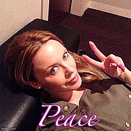 Kylie peace with caption | image tagged in kylie peace with caption | made w/ Imgflip meme maker