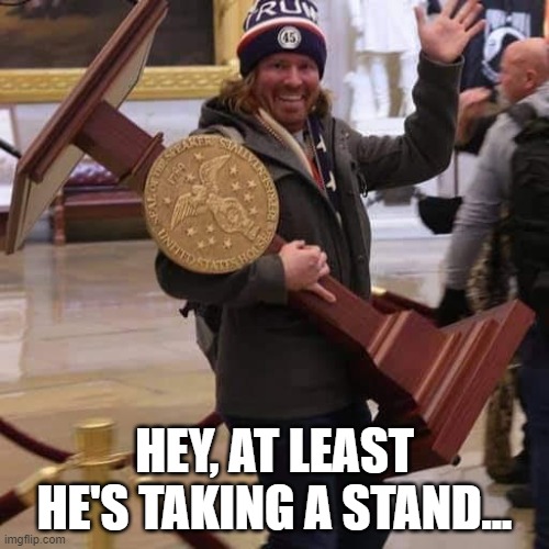taking a stand | HEY, AT LEAST HE'S TAKING A STAND... | image tagged in taking a stand,i love democracy,protesters | made w/ Imgflip meme maker