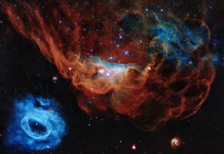 Cosmic Reef. Red and blue nebulas in the Large Magellanic Cloud, a satellite galaxy of the Milky Way. Photo credit: NASA | image tagged in awesome,pics,photography | made w/ Imgflip meme maker