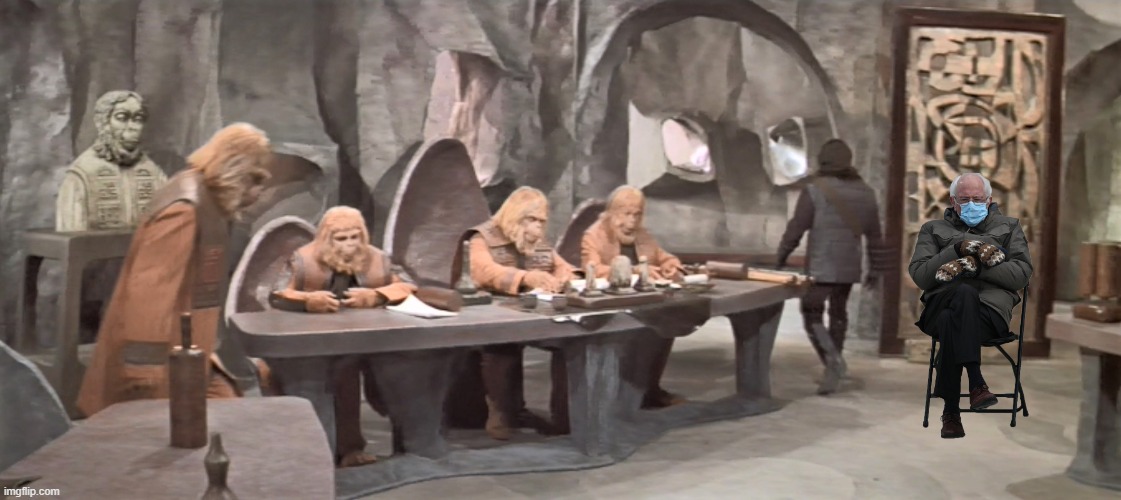 Funny Bernie Sanders Mittens meme with Bernie seated during a trial in 'The Planet of the Apes'. | image tagged in memes,funny memes,bernie sanders mittens,bernie sanders,political memes,planet of the apes | made w/ Imgflip meme maker
