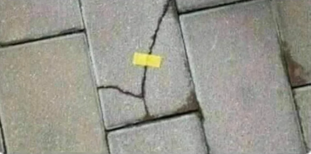 Brick held with a yellow tape Blank Meme Template