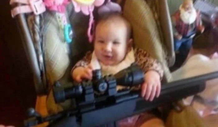 Baby Holding Rifle Blank Meme Template