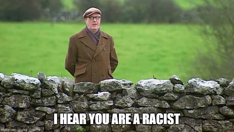 Racist father Ted | I HEAR YOU ARE A RACIST | image tagged in racist father ted | made w/ Imgflip meme maker