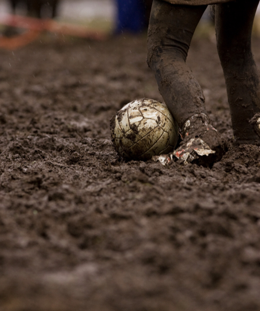 Soccer Mom Watching Athlete on Wet, Muddy Field Blank Meme Template