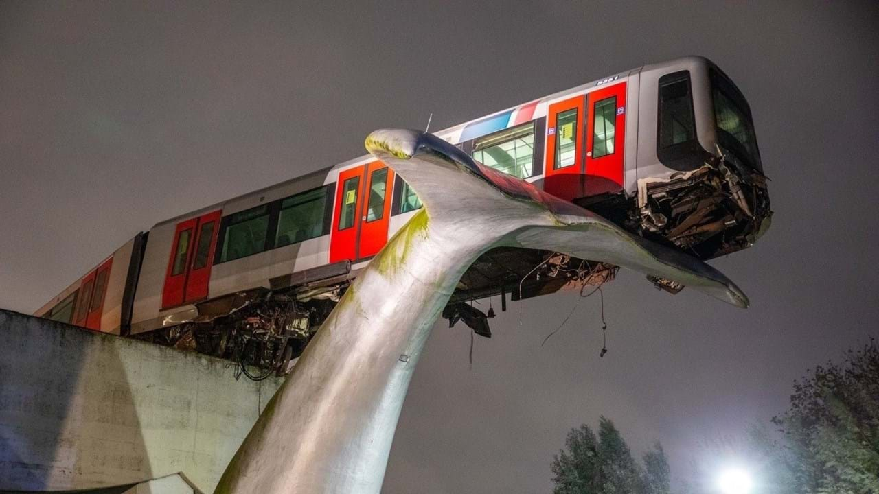 Whale sculpture holding train Blank Meme Template