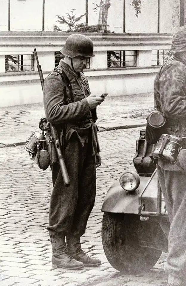 German soldier looking at Smartphone Blank Meme Template